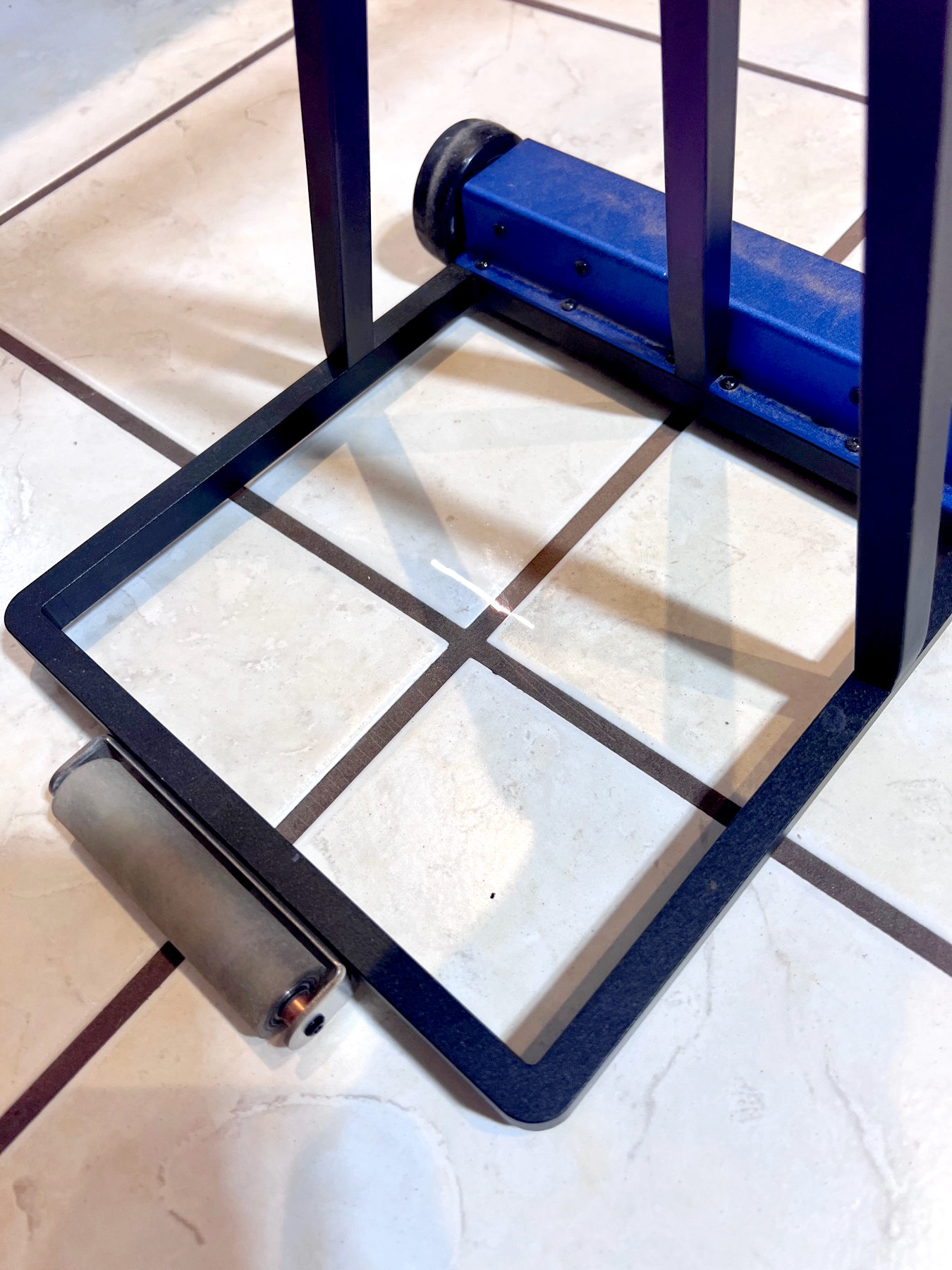 Precision laser grout cleaning equipment on tile floor, Vancouver Island